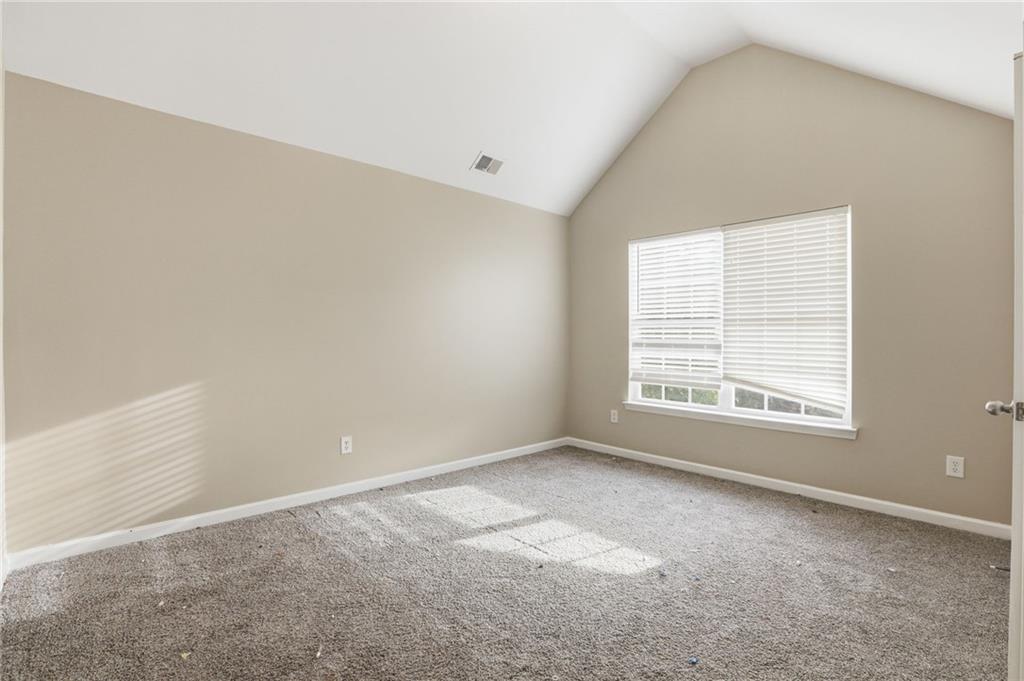 4968 Locherby Drive Fairburn, GA 30213 - Photo 25 of 39 an empty room with a window