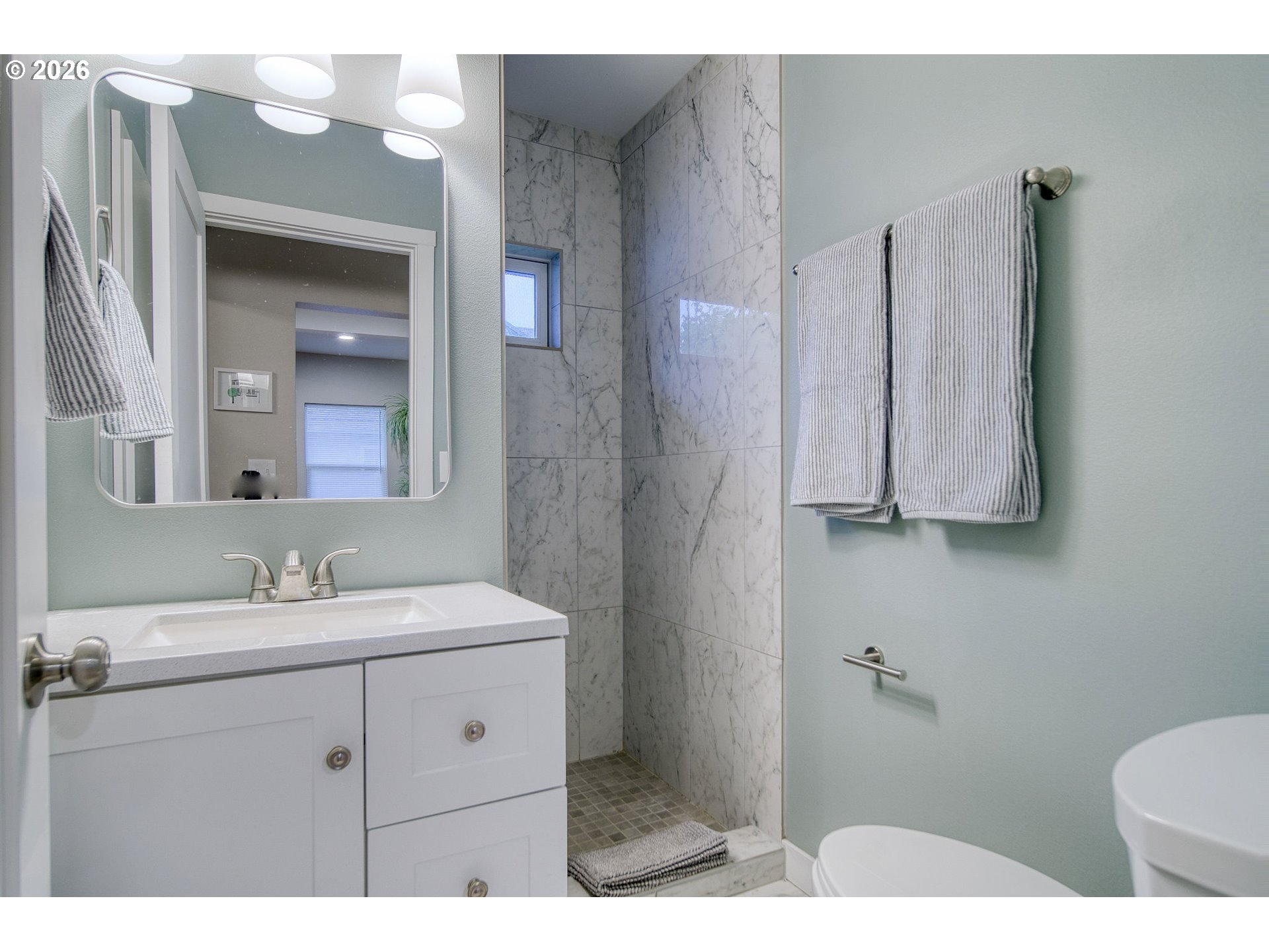 274 North 3rd Street St. Helens, OR 97051 - Photo 15 of 30 a bathroom with a sink vanity and mirror