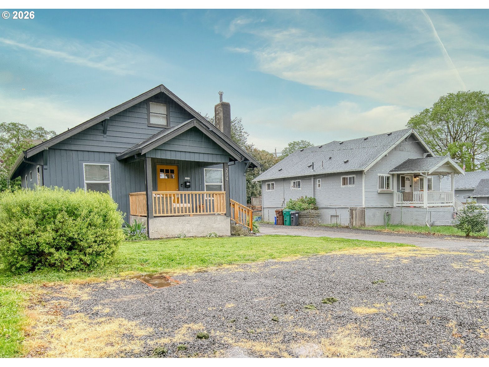 274 North 3rd Street St. Helens, OR 97051 - Photo 2 of 30 a view of a house with a big yard and large trees
