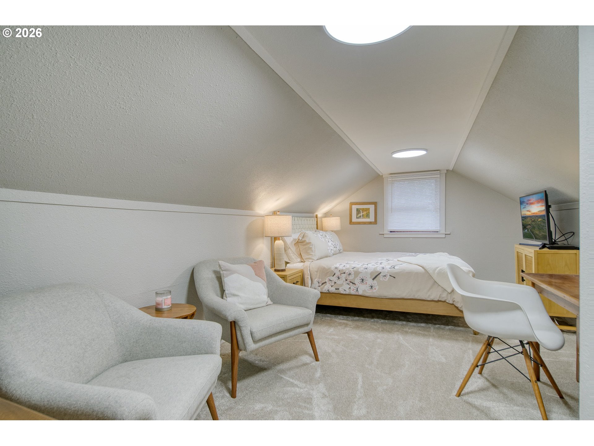 274 North 3rd Street St. Helens, OR 97051 - Photo 22 of 30 a bedroom with a bed and a chair