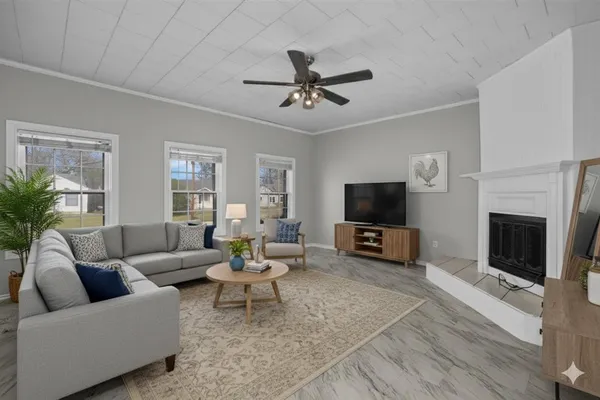 a living room with furniture and a flat screen tv