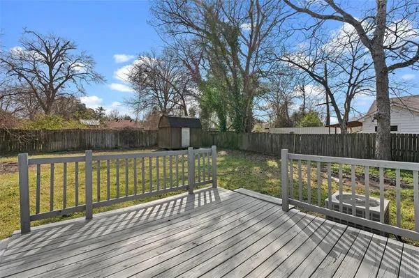 a view of a wooden deck with a bench
