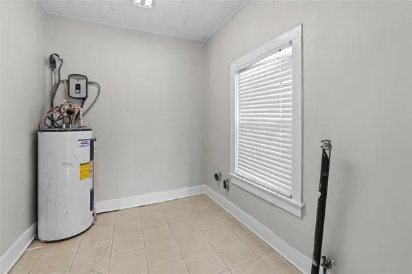 a view of a storage & utility room with a window
