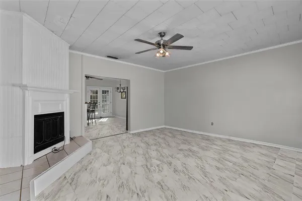 a view of empty room with fireplace