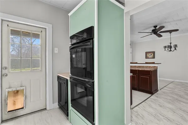 a view of a kitchen from the hallway
