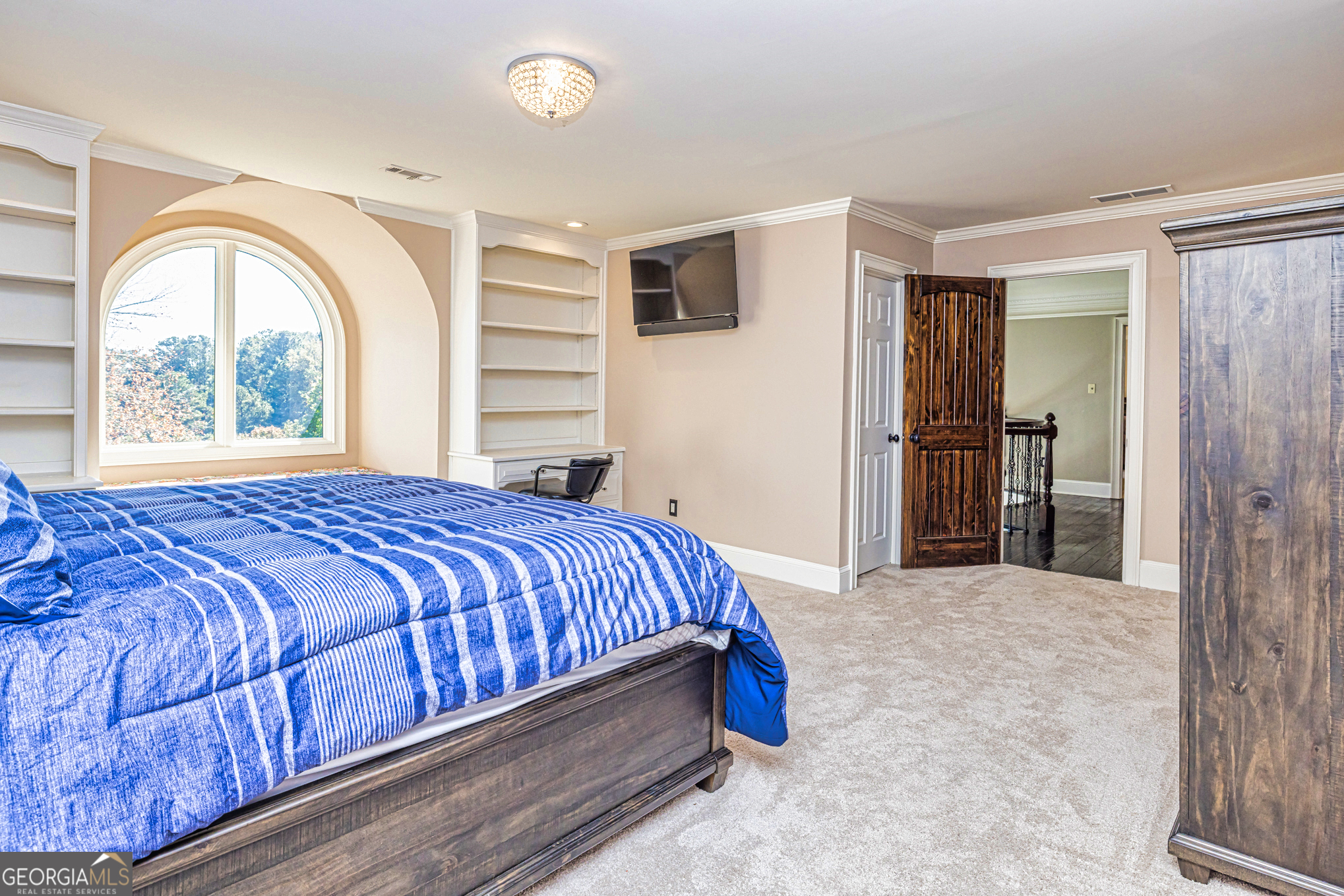 131 Lincoln Road Tyrone, GA 30290 - Photo 56 of 78 a bed sitting in a spacious bedroom next to a window