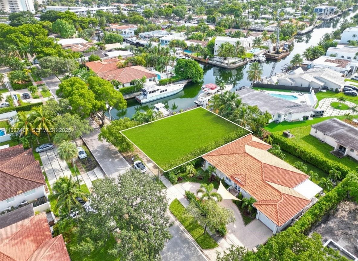 12735 Ixora Road North Miami, FL 33181 - Photo 12 of 21 an aerial view of a house with a garden