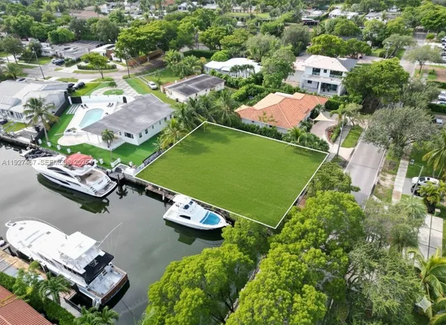 an aerial view of a residential houses with outdoor space