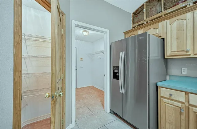 a view of a kitchen with white cabinets