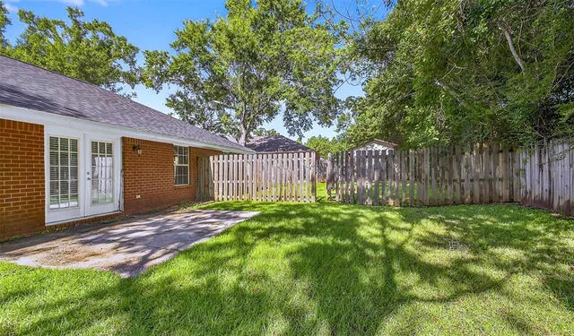 a backyard of a house with lots of green space