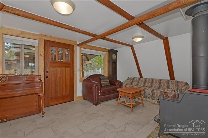 19161 Shoshone Road Bend, OR 97702 - Photo 11 of 25 view of front door, tile floor, wood bea
