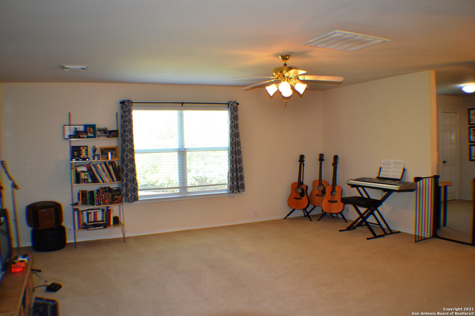 1715 Mountain Brook Schertz, TX 78154 - Photo 16 of 44 a living room with furniture a chandelier and a window