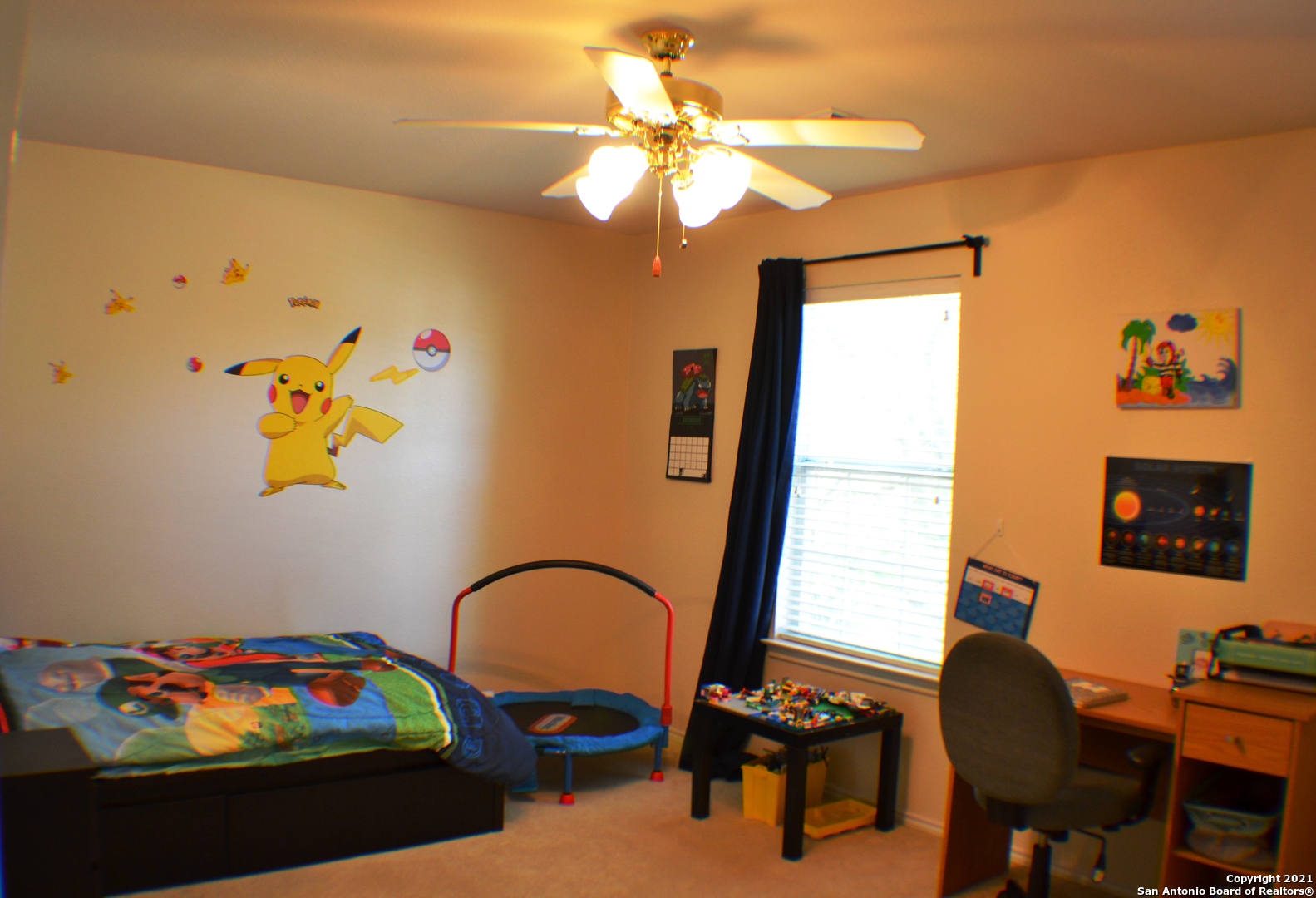 1715 Mountain Brook Schertz, TX 78154 - Photo 22 of 44 a bedroom with a bed and a chandelier