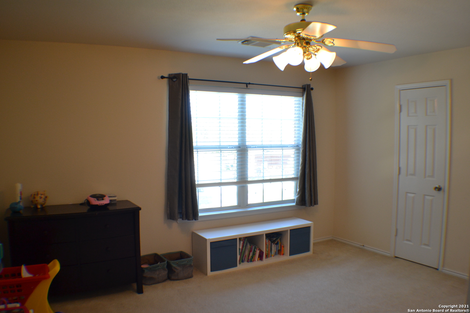 1715 Mountain Brook Schertz, TX 78154 - Photo 23 of 44 a room with chandelier fan and windows