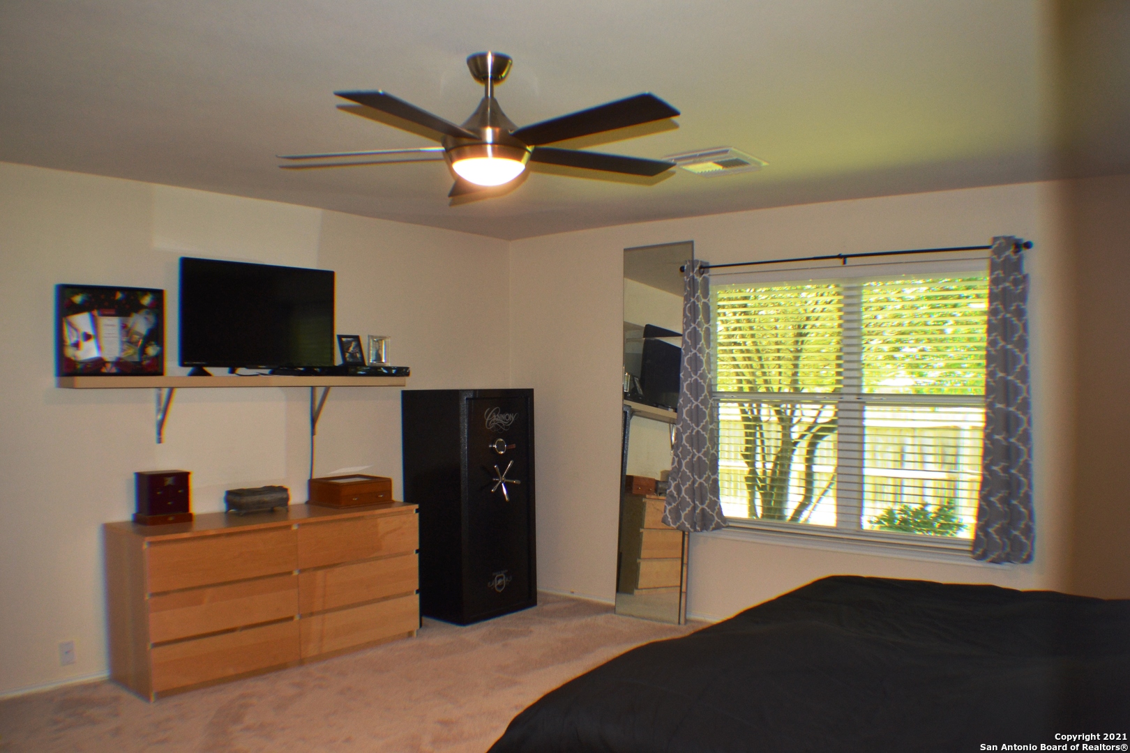 1715 Mountain Brook Schertz, TX 78154 - Photo 30 of 44 a bedroom with a bed and a flat screen tv