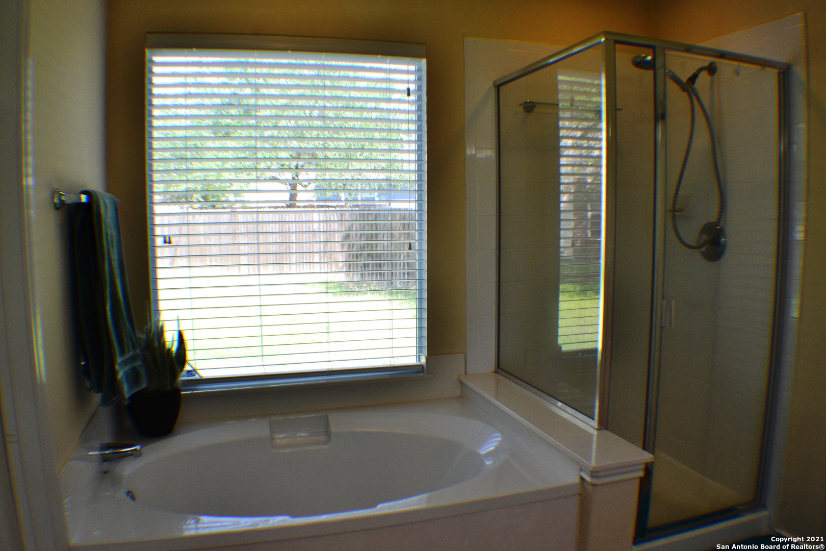 1715 Mountain Brook Schertz, TX 78154 - Photo 33 of 44 a bathroom with a bathtub and a shower