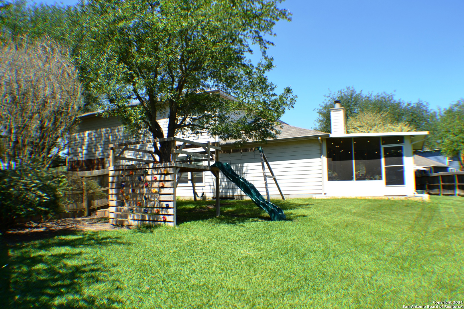 1715 Mountain Brook Schertz, TX 78154 - Photo 38 of 44 a view of a house with backyard and a tree