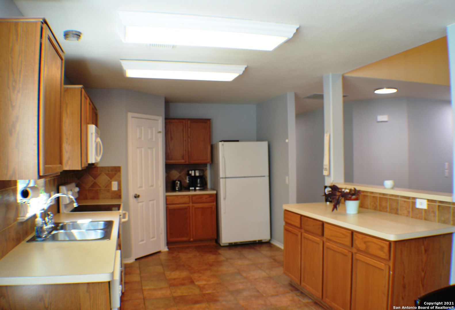1715 Mountain Brook Schertz, TX 78154 - Photo 4 of 44 a kitchen with a refrigerator sink and stove
