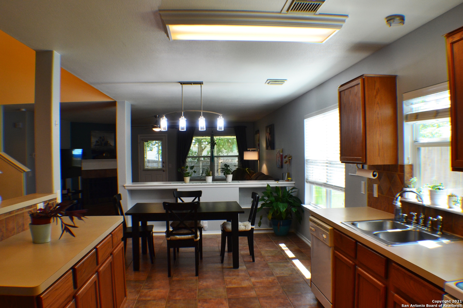 1715 Mountain Brook Schertz, TX 78154 - Photo 6 of 44 a kitchen with kitchen island granite countertop lots of counter top space and dining table