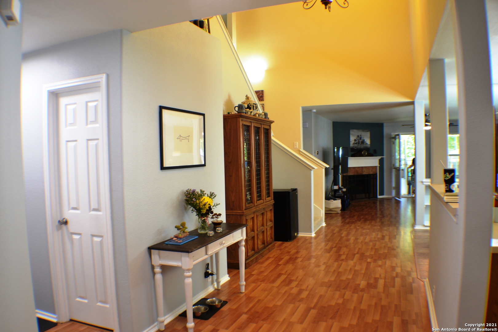 1715 Mountain Brook Schertz, TX 78154 - Photo 10 of 44 a view of a hallway view with wooden floor and staircase