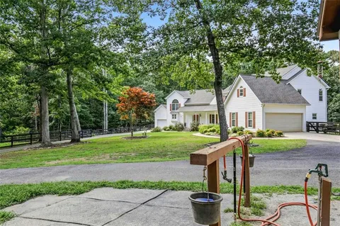 a backyard of a house with lots of green space