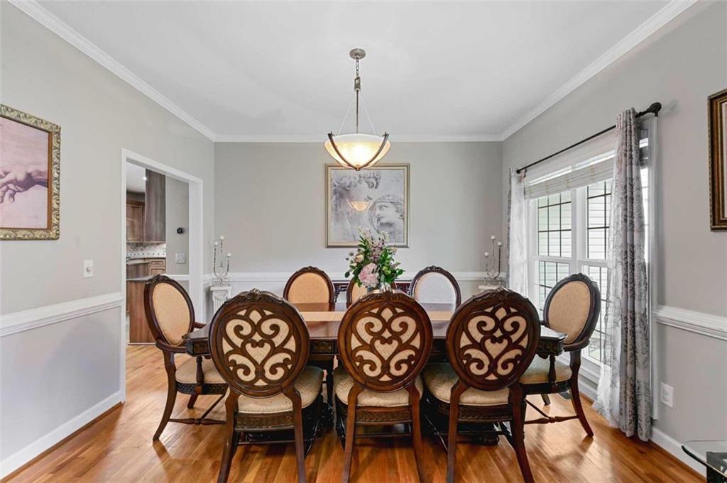 2203 Arbor Hill Road Canton, GA 30115 - Photo 31 of 64 a view of a dining room and hall with furniture