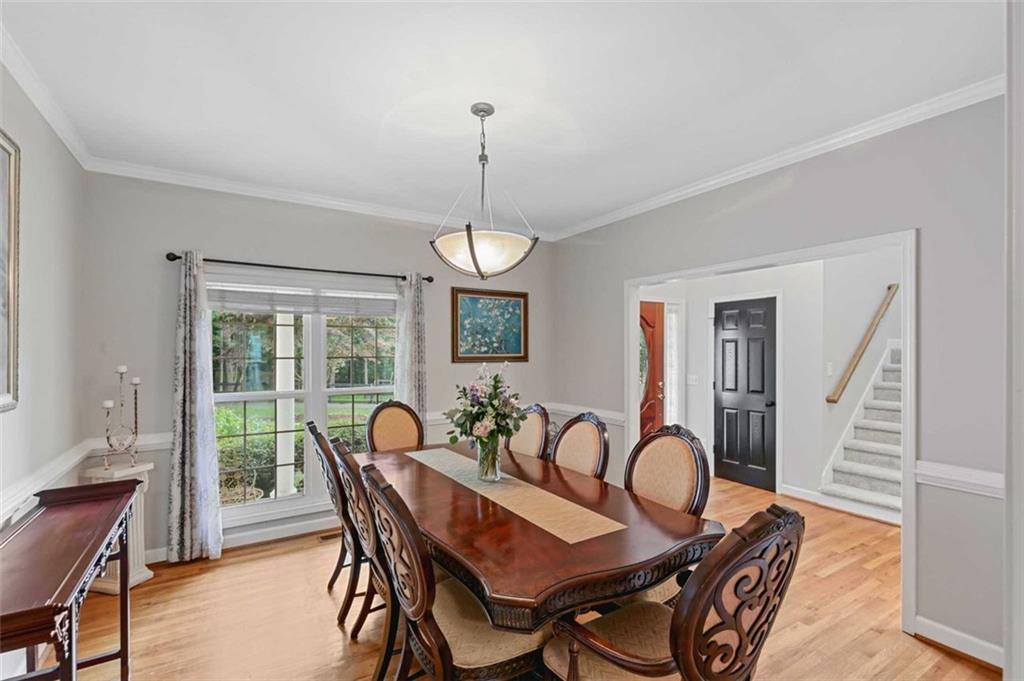 2203 Arbor Hill Road Canton, GA 30115 - Photo 32 of 64 a view of a dining room with furniture window and wooden floor