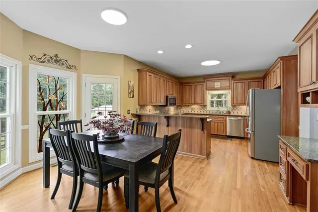 a view of walk in closet with clothes