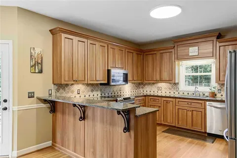 a bedroom with a bed and a ceiling fan