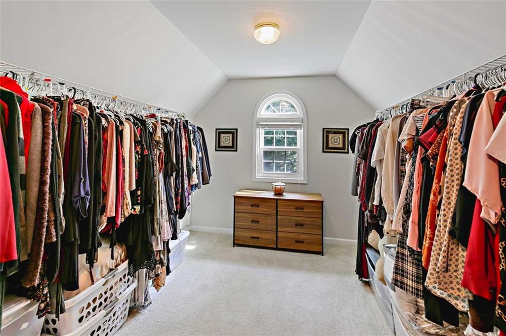 2203 Arbor Hill Road Canton, GA 30115 - Photo 45 of 64 a view of walk in closet with clothes