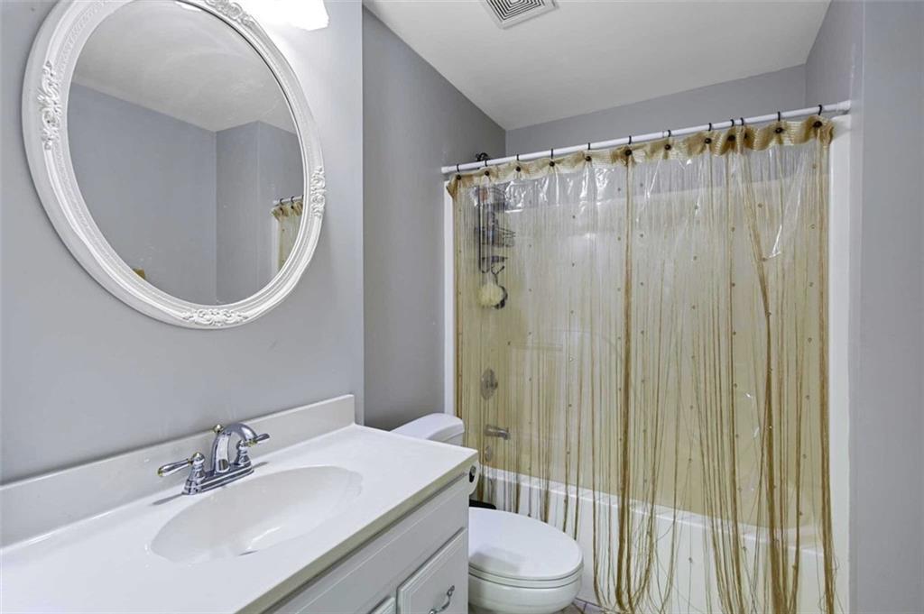 2203 Arbor Hill Road Canton, GA 30115 - Photo 53 of 64 a bathroom with a sink a toilet and shower