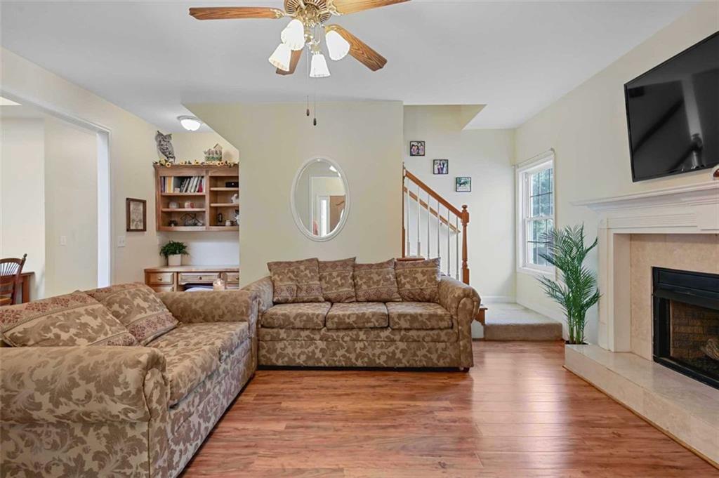 2203 Arbor Hill Road Canton, GA 30115 - Photo 55 of 64 a living room with furniture and a fireplace