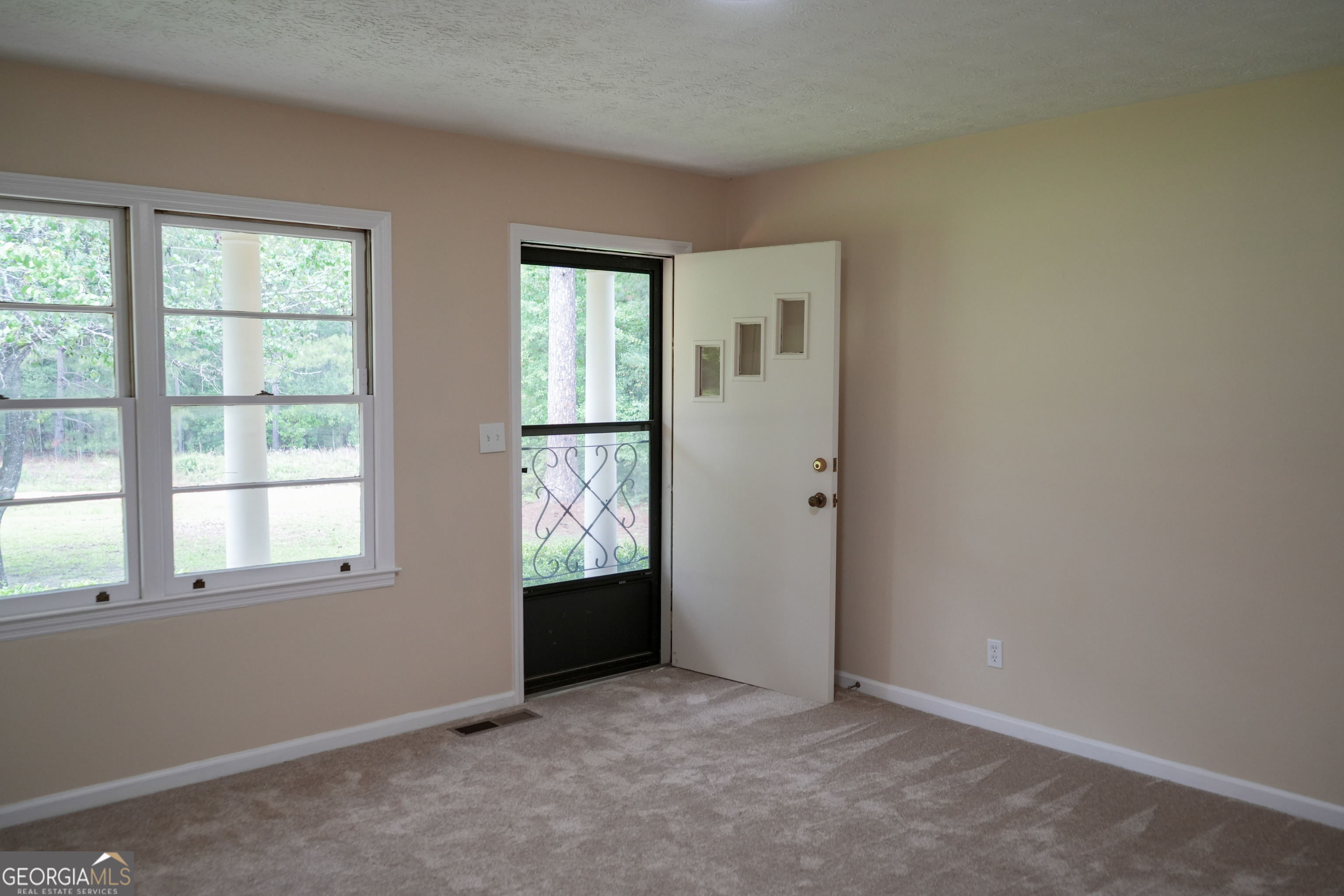 1869 Minter Blue Springs Road Rockledge, GA 30454 - Photo 20 of 45 an empty room with windows
