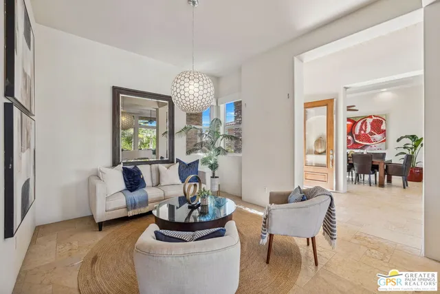 a kitchen with stainless steel appliances granite countertop a stove a sink and a refrigerator with wooden floor