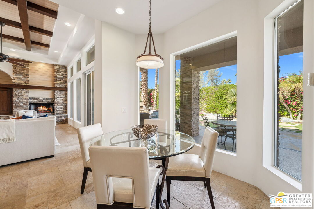 2 Varsity Circle Rancho Mirage, CA 92270 - Photo 18 of 65 a dining room with furniture window wooden floor