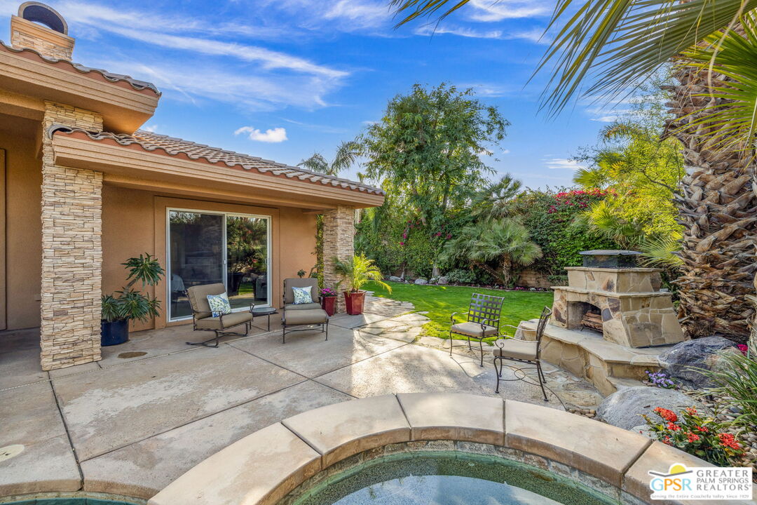2 Varsity Circle Rancho Mirage, CA 92270 - Photo 24 of 65 a view of a patio with table and chairs and potted plants