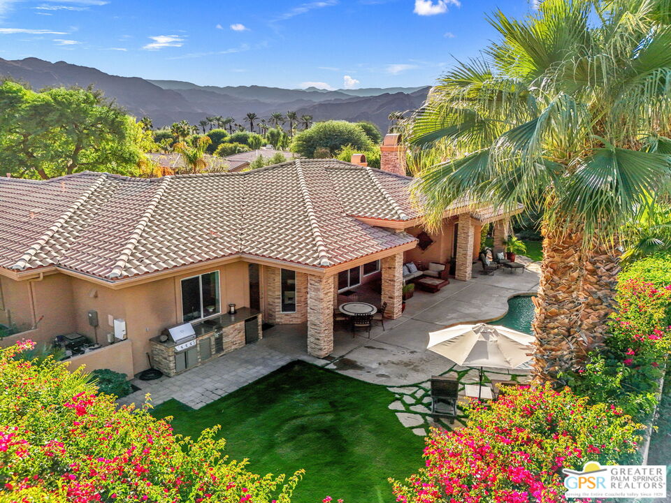 2 Varsity Circle Rancho Mirage, CA 92270 - Photo 29 of 65 a view of a patio with table and chairs and potted plants