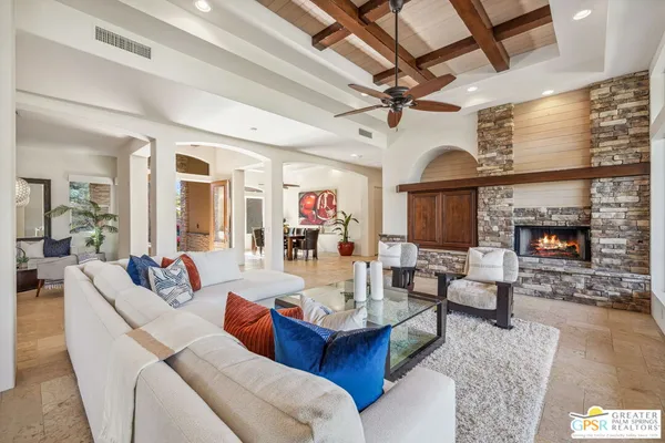a bedroom with furniture and a potted plant