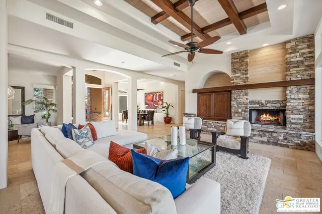 a bedroom with furniture and a potted plant