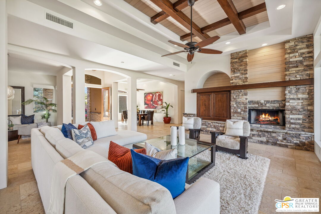 2 Varsity Circle Rancho Mirage, CA 92270 - Photo 32 of 65 a living room with furniture and a fireplace