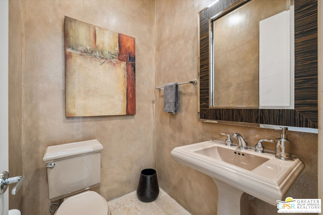 2 Varsity Circle Rancho Mirage, CA 92270 - Photo 40 of 65 a bathroom with a sink mirror and toilet