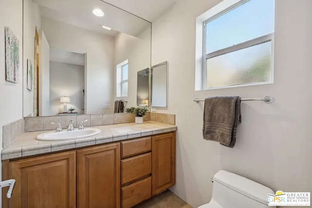 a living room with fireplace furniture and a flat screen tv