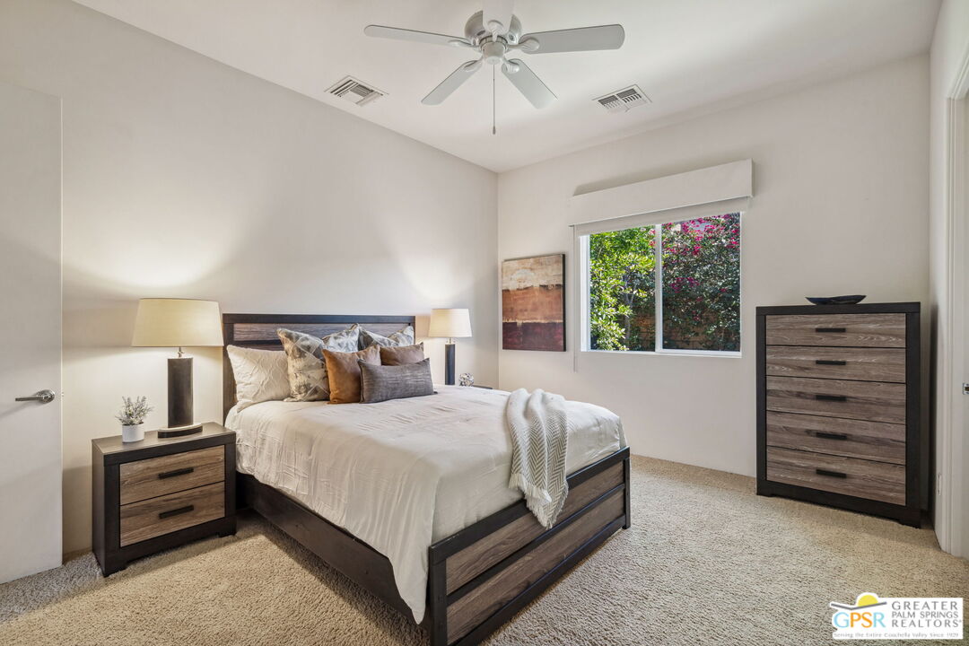 2 Varsity Circle Rancho Mirage, CA 92270 - Photo 46 of 65 a bedroom with a bed and a ceiling fan