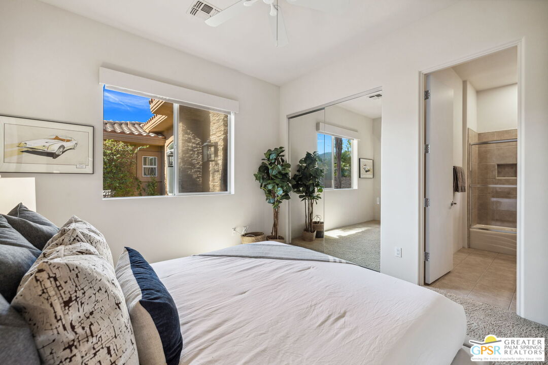 2 Varsity Circle Rancho Mirage, CA 92270 - Photo 50 of 65 a bedroom with a bed and a potted plant