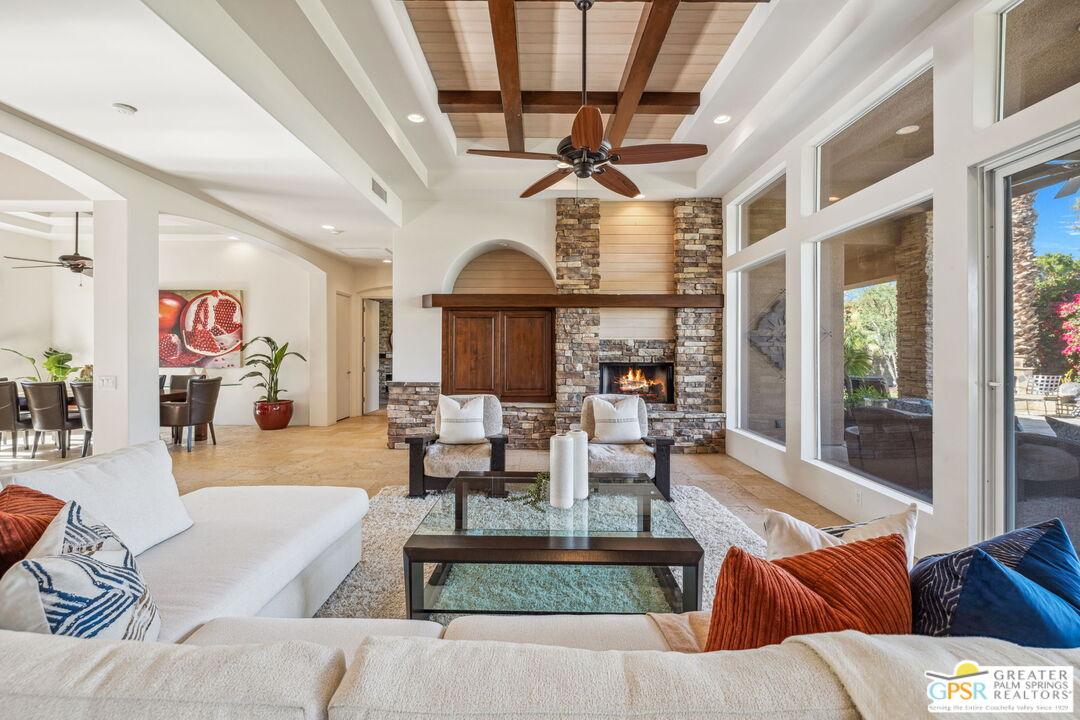 2 Varsity Circle Rancho Mirage, CA 92270 - Photo 5 of 65 a living room with furniture and a chandelier
