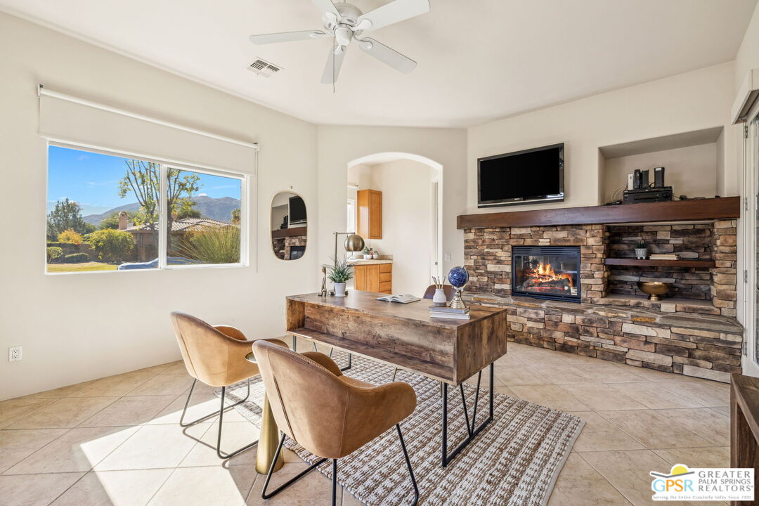 2 Varsity Circle Rancho Mirage, CA 92270 - Photo 55 of 65 a living room with fireplace furniture and a flat screen tv