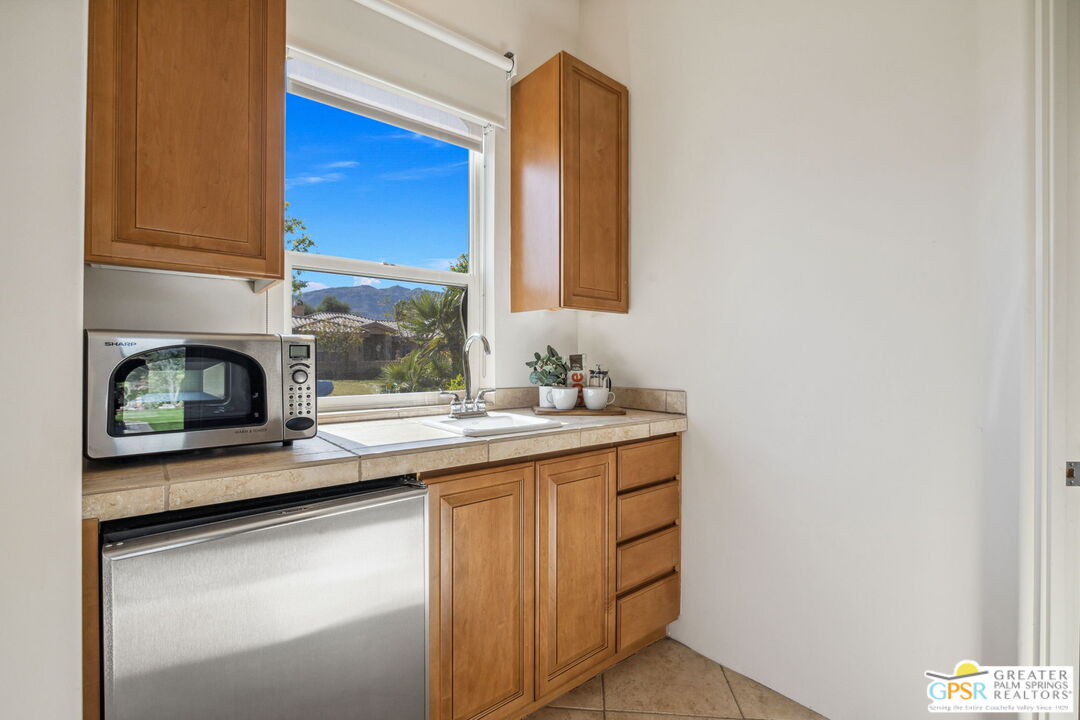 2 Varsity Circle Rancho Mirage, CA 92270 - Photo 58 of 65 a kitchen with a sink and a window