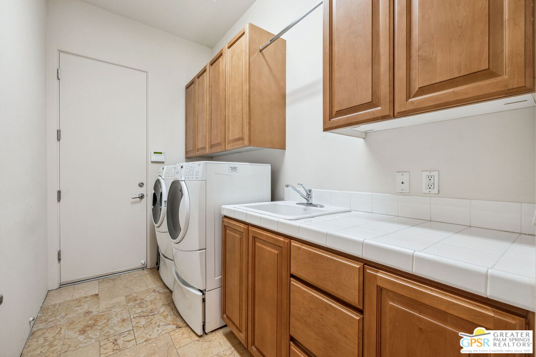 2 Varsity Circle Rancho Mirage, CA 92270 - Photo 61 of 65 a utility room with cabinets