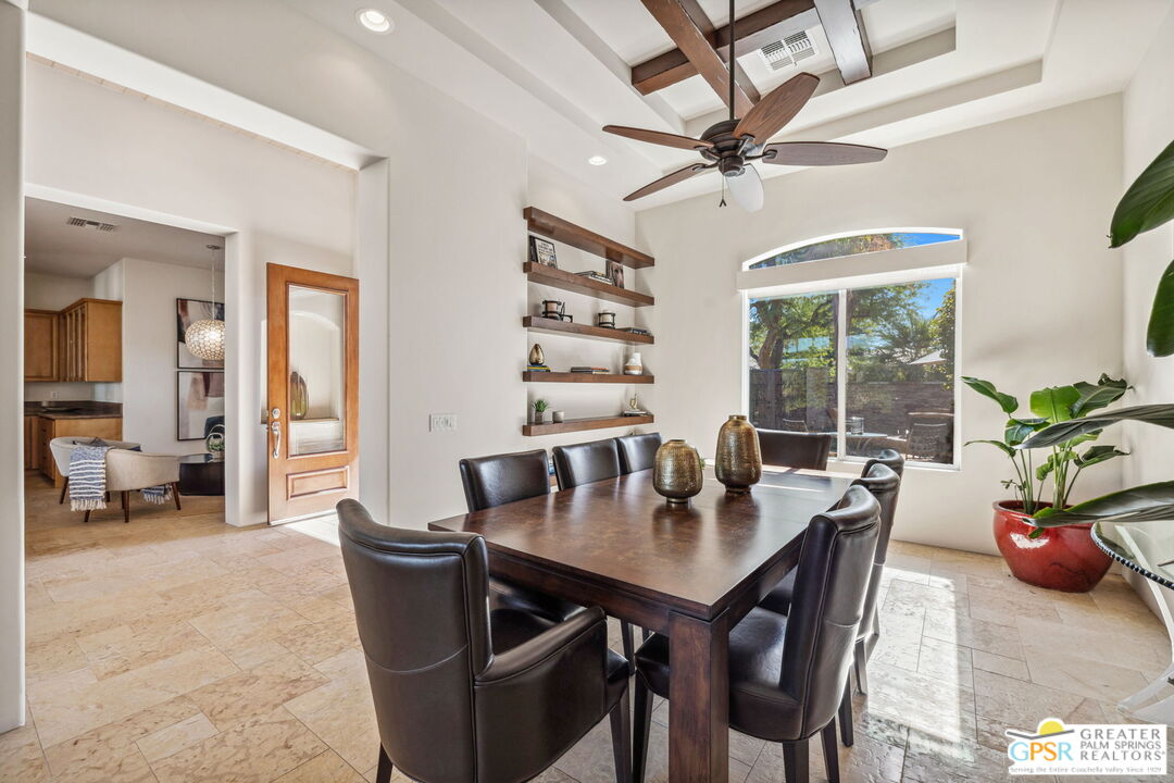 2 Varsity Circle Rancho Mirage, CA 92270 - Photo 8 of 65 a view of a dining room and livingroom with furniture