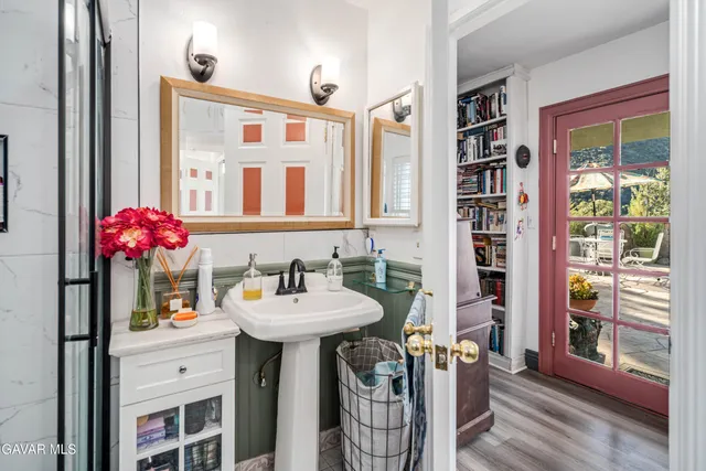 a bathroom with a sink and a mirror